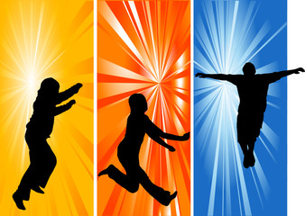 Silhouettes of three jumping people