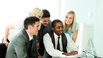 Fototapeta premium Businesspeople working with a laptop in the office