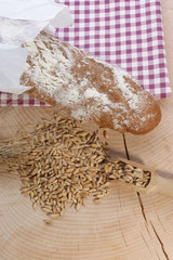 Cottage loaf and cereal on a timber background