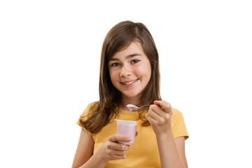 Girl eating yogurt isolated on white background