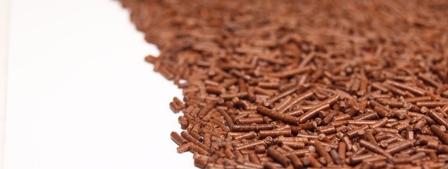 Chocolate granules background, low depth of focus