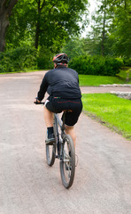 One bicyclists on the park track