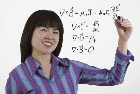 woman writing math equation