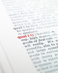 The word 'quality' highlighted in a dictionary