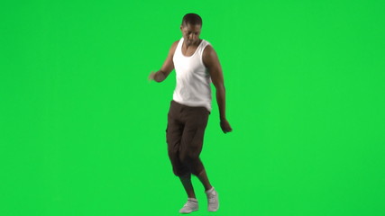 Young man dancing with a green background - Powered by Adobe