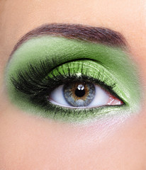 Naklejka premium Green make-up of woman eye