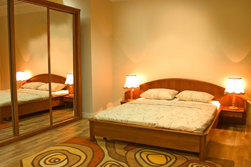 Interior of modern bedroom with furniture