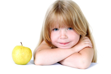 little girl with yellow apple isolated on white