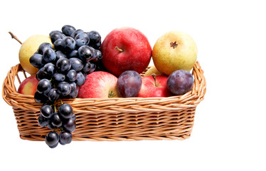 Ripe autumn fruits at the wooden basket.