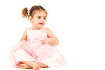 Portrait of young girl in pink princess dress, studio shot