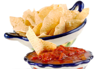 Bowl of chunky red salsa with crispy corn tortilla chips