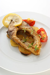 carp fillet on organic potato and lemon