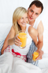 Woman holding a glass of orange juice