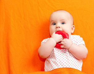 Infant with teething toy