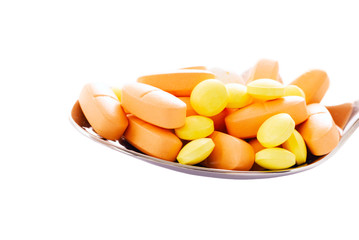 Spoon on a lie tablets, abstract medical background