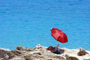 chair and umbrella by the beach