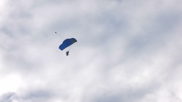 HD skydiving in blue sky with clouds