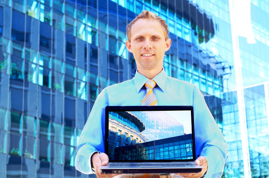 Happiness businessman on blur business architecture background