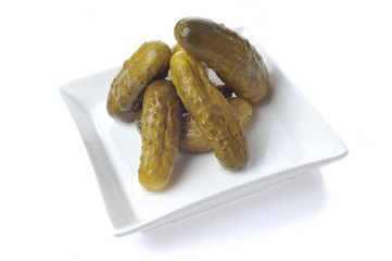 Fototapeta premium pickles on plate isolated on white