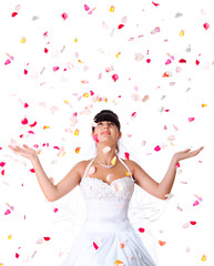 Cute bride throws rose petals