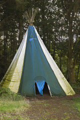 A teepee at a campsite in the woods © themightyshrub
