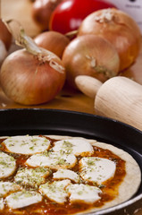 preparing pizza