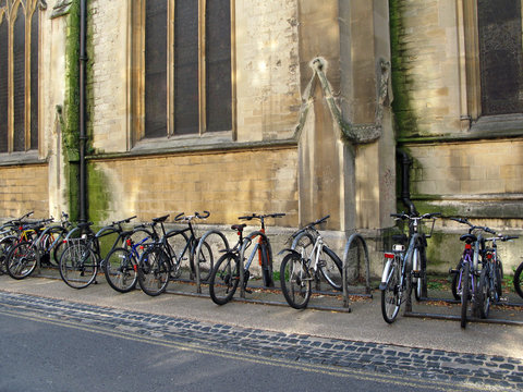 Vintage Bicycles By The Wall Of Oxford University Building.