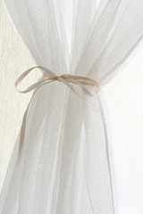 White curtain with bow