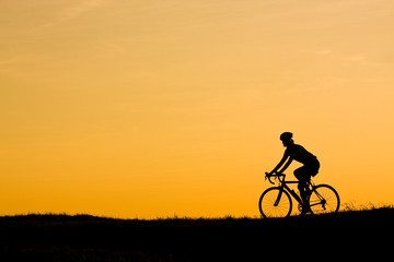 Obraz na płótnie Canvas Sunset cycling