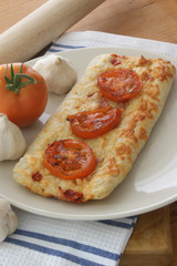 stone oven backed pizza with grilled tomato