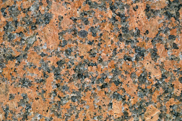 Red granite texture, close-up image