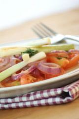 warm tomato salad with organic spring onion