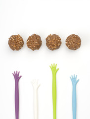 Hands reaching for chocolates