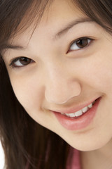 Studio Portrait of Smiling Teenage Girl