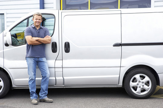Man standing next to van