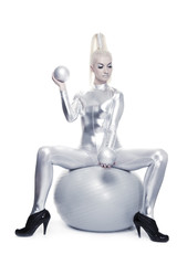 Obraz na płótnie Canvas Beautiful cyber woman sitting on a silver ball ....