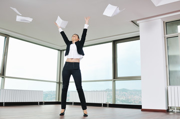 Fototapeta na wymiar young business woman throw papers in air