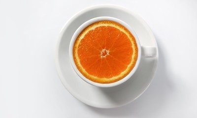 Orange slice in a coffee cup
