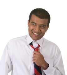 Middle Eastern man adjusting tie shot against white background
