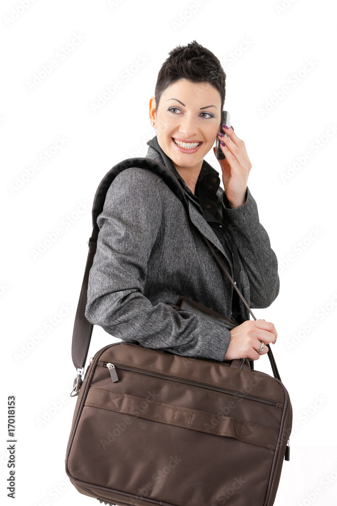 Wall mural businesswoman calling on mobile