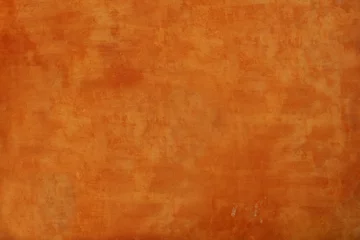 Möbelaufkleber Strukturierter orangefarbener Wandhintergrund © Matthew Cross