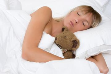 Sleeping Girl Hugging Bear