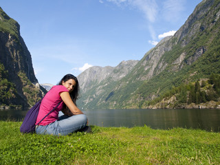 Woman relaxing in the fjord of Gudvangen