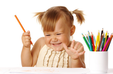 Happy child play with color pencils and smile