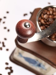 Detail of coffee grinder on white background