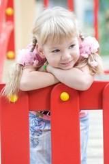 Obraz na płótnie Canvas Cute girl posing on the playground.