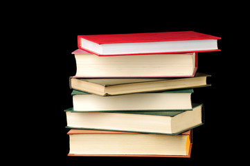 Stack of books isolated over black background