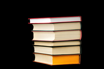 Stack of books isolated over black background