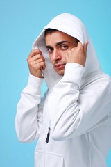 Attractive young man on a blue background.