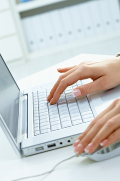 Femal hands using laptop